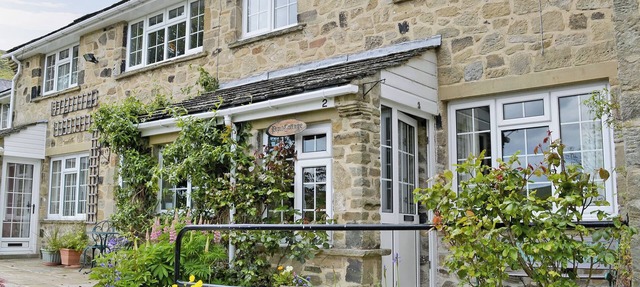 20 steps to entrance with handrail. in Burnsall near Grassington