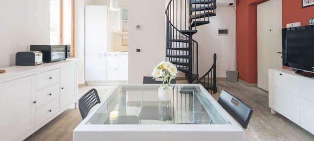 Welcome to this bright, three-level apartment located in the heart of the Navigli neighborhood in downtown Milan in Milano